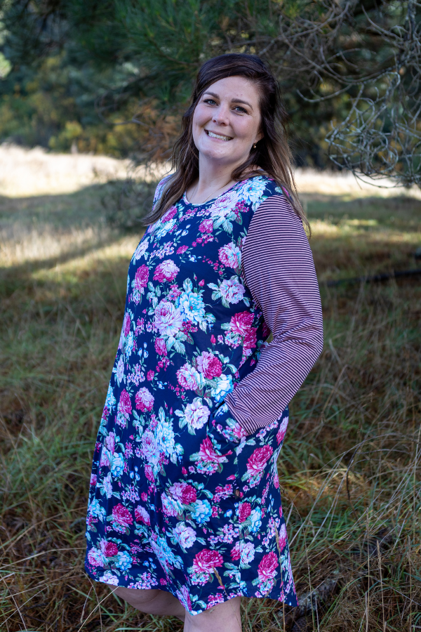 Full floral dress with beautiful pink and navy sleeves with floral cuffs