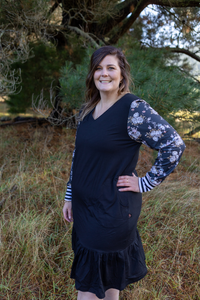 Emily Rose Designs Eloise dress with a black body and floral sleeves off set with stripe cuffs