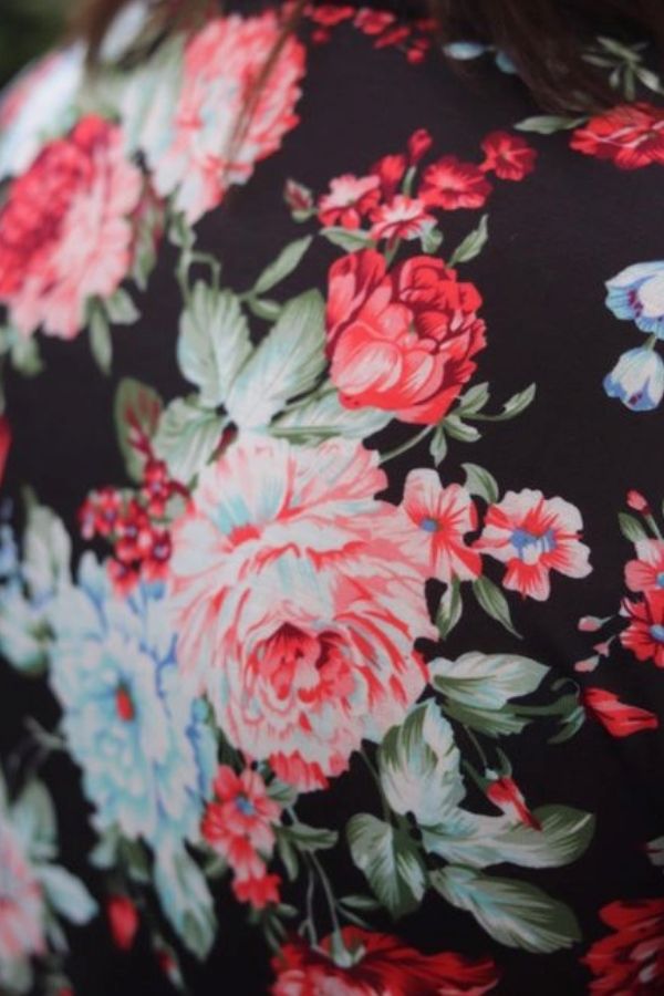 Noelle Dress Mini Me by Emily Rose Designs. Close up of floral fabric on back and sleeves. Affordable, comfortable New Zealand designed girls’ dresses.